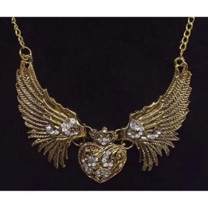Betsey Johnson’s Gold-tone Heart with Wings.